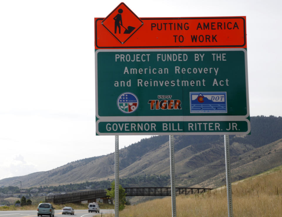 A sign announces a section of road work funded by the American Recovery and Reinvestment Act U.S. economic stimulus plan in the Denver area September 10, 2009. The White House Council of Economic Advisers said that the $787 billion stimulus package enacted earlier this year had created as many as 1.1 million jobs by the third quarter.  REUTERS/Rick Wilking (UNITED STATES BUSINESS SOCIETY)