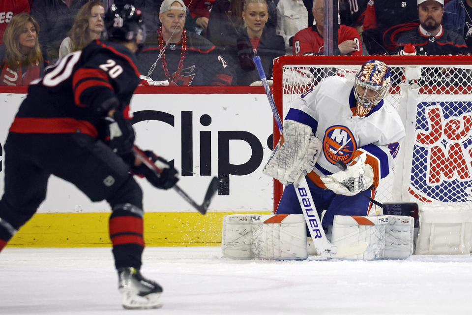 New York Islanders goaltender Semyon Varlamov (40) catches the shot of Carolina Hurricanes' Sebastian Aho (20) during the first period in Game 2 of an NHL hockey Stanley Cup first-round playoff series in Raleigh, N.C., Monday, April 22, 2024. (AP Photo/Karl B DeBlaker)