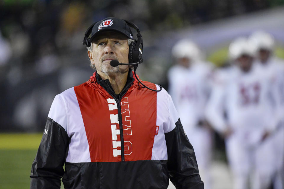 Utah head coach Kyle Whittingham looks at the scoreboard after taking a timeout against Oregon during the second half of an NCAA college football game Saturday, Nov. 19, 2022, in Eugene, Ore. (AP Photo/Andy Nelson)