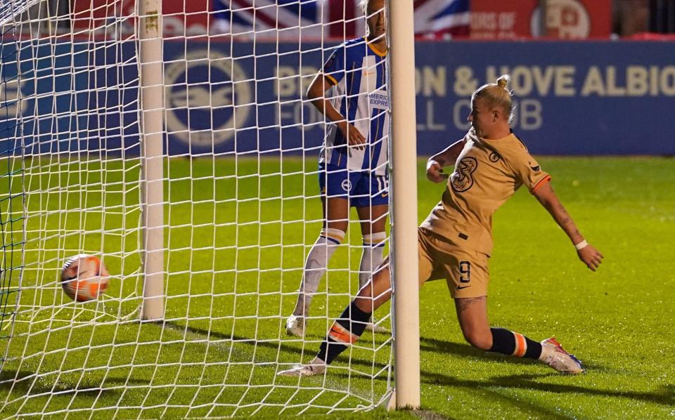 Beth England scores the visitors' first on a wet night in Brighton - PA