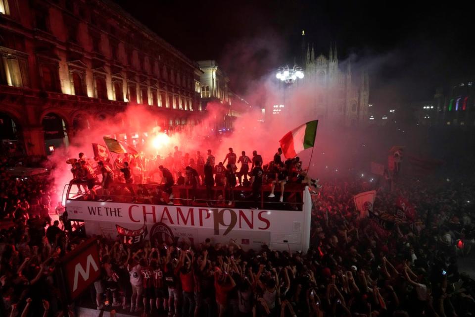 AC Milan celebrated their title win with a bus parade through the city (AP Photo/Luca Bruno) (AP)