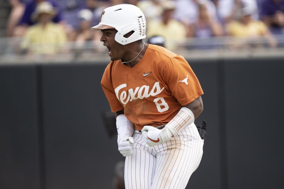 Texas' Dylan Campbell celebrates after hitting a three-run home run during the eighth inning of an NCAA college super regional baseball game against East Carolina on Saturday, June 11, 2022, in Greenville, N.C. (AP Photo/Matt Kelley)