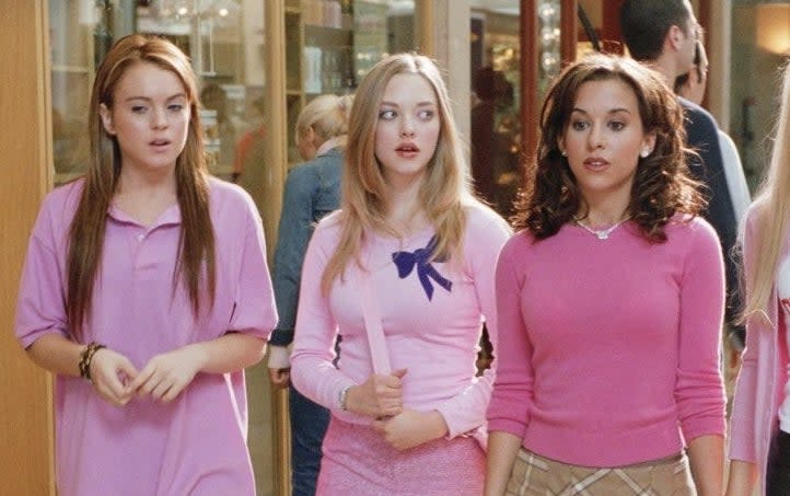 They're all wearing pink, but lindsay is in an oversized shirt on cady's first wednesday as a plastic