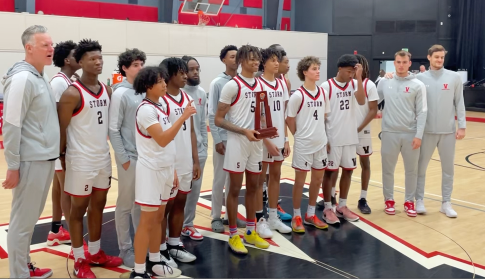 Victory Christian poses with the district trophy after defeating Legacy Charter.