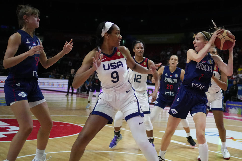 Serbia's Ivana Raca, right, looks to pass the ball past United States' A'ja Wilson during their quarterfinal game at the women's Basketball World Cup in Sydney, Australia, Thursday, Sept. 29, 2022. (AP Photo/Mark Baker)