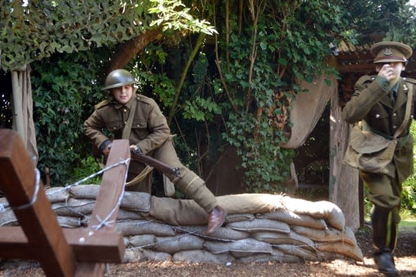 Boys create WW1 trench in garden