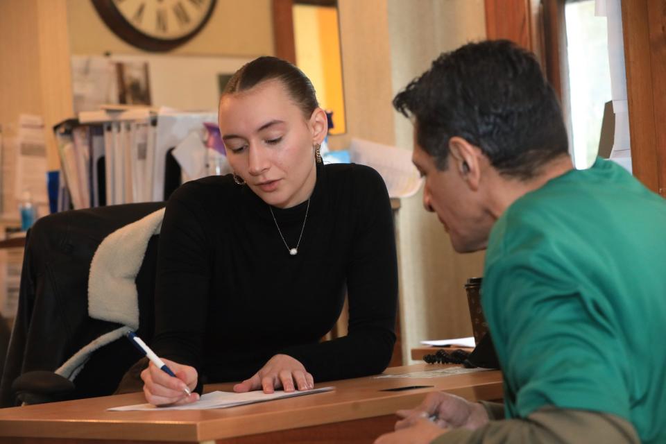 Madison Ahouse, senior case manager for the Poughkeepsie office of Exodus Transitional Community works with a new client, Frank Garcia on December 11, 2023.