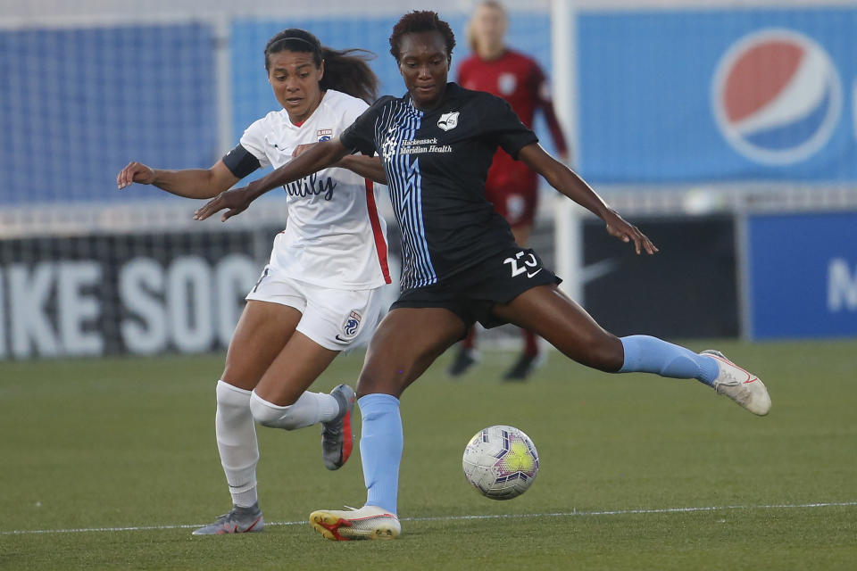 Sky Blue FC foward Ifeoma Onumonu (25) controls the ball as OL Reign midfielder Shirley Cruz, left, defends during the first half of an NWSL Challenge Cup soccer match at Zions Bank Stadium on Tuesday, June 30, 2020, in Herriman, Utah. (AP Photo/Rick Bowmer)