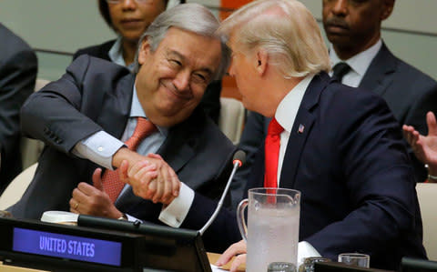 UN Secretary General Guterres shakes hands with Trump at UN Headquarters in New York - Credit: Reuters