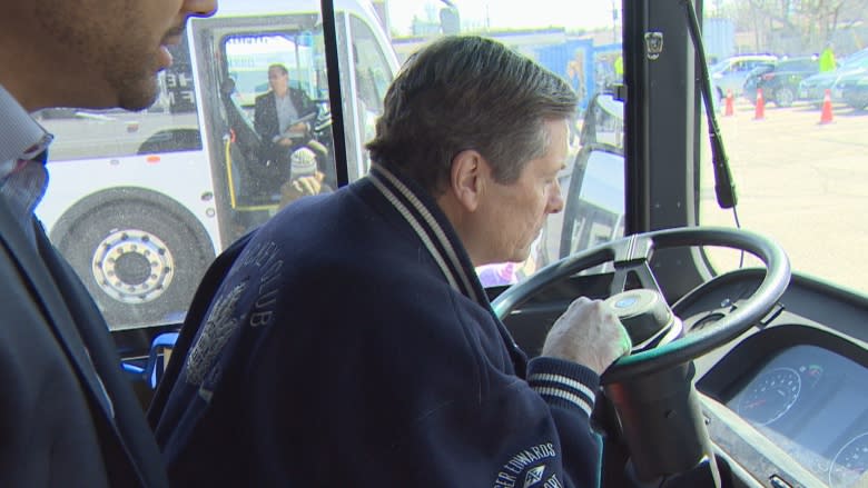 Mayor John Tory gets behind wheel of electric bus as part of new TTC program