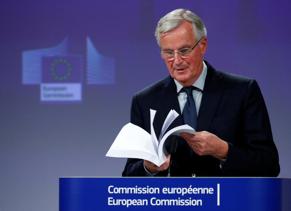 EU chief negotiator Michel Barnier with the completed Withdrawal Agreement (Reuters)