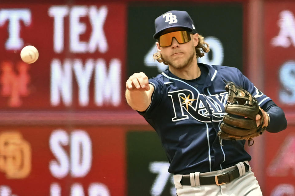 Tampa Bay Rays' second baseman Taylor Walls throws to first base to put out Toronto Blue Jays' designated hitter Vladimir Guerrero Jr., not shown, during the sixth inning of a baseball game, Saturday, July 2, 2022 in Toronto. (Jon Blacker/The Canadian Press via AP)