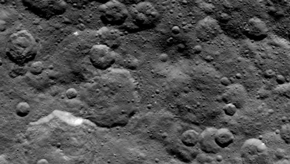 NASA's Dawn spacecraft obtained this image of craters in the northern hemisphere of dwarf planet Ceres on June 6, 2015, from an altitude of 2,700 miles (4,400 kilometers). Image released June 10, 2015.