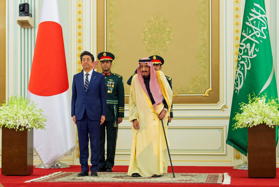 In this photo released by Saudi Press Agency, SPA, Saudi King Salman, right, receives Japan's Prime Minister Shinzo Abe in Riyadh, Saudi Arabia, Sunday, Jan. 12, 2020. (Saudi Press Agency via AP)