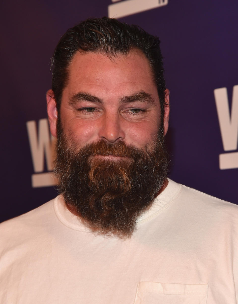 Evan Marriott smiling at an event with a large beard