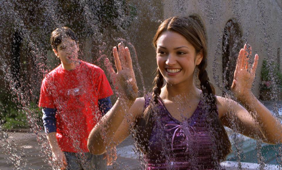 Jesse Bradford and Paula Garces look at a frozen sprinkler