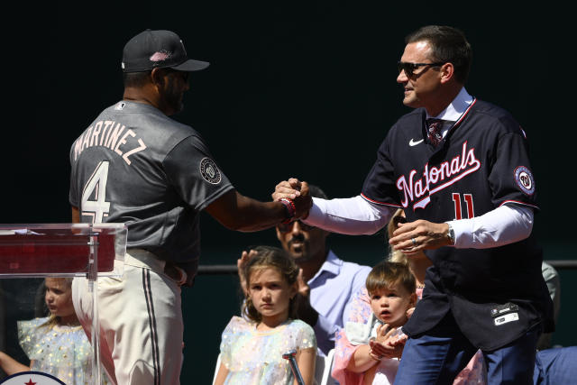 Keith Zimmerman, father of former Washington Nationals baseball player Ryan  Zimmerman, holds up Ryan's jersey at a jersey retirement ceremony before a  baseball game between the Nationals and the Philadelphia Phillies, Saturday