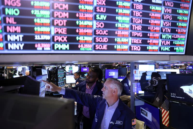 Traders work on the trading floor at the New York Stock Exchange (NYSE) in Manhattan, New York City