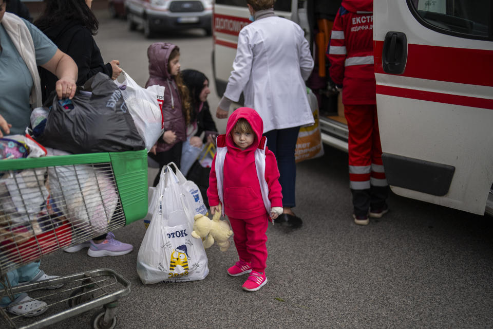 Patients are evacuated from Children's Hospital No. 1 on the outskirts of Kyiv, Ukraine, Friday, April 26, 2024. Doctors and ambulance crews evacuated patients from a Kyiv children's hospital on Friday after a video circulated online saying Russia planned to attack it. (AP Photo/Francisco Seco)