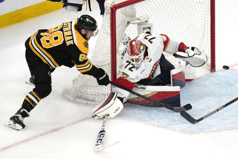 Florida Panthers goaltender Sergei Bobrovsky (72) drops his stick to the ice as a shot by Boston Bruins right wing David Pastrnak (88) goes wide during the second period of Game 5 in the first round of the NHL hockey playoffs, Wednesday, April 26, 2023, in Boston. (AP Photo/Charles Krupa)