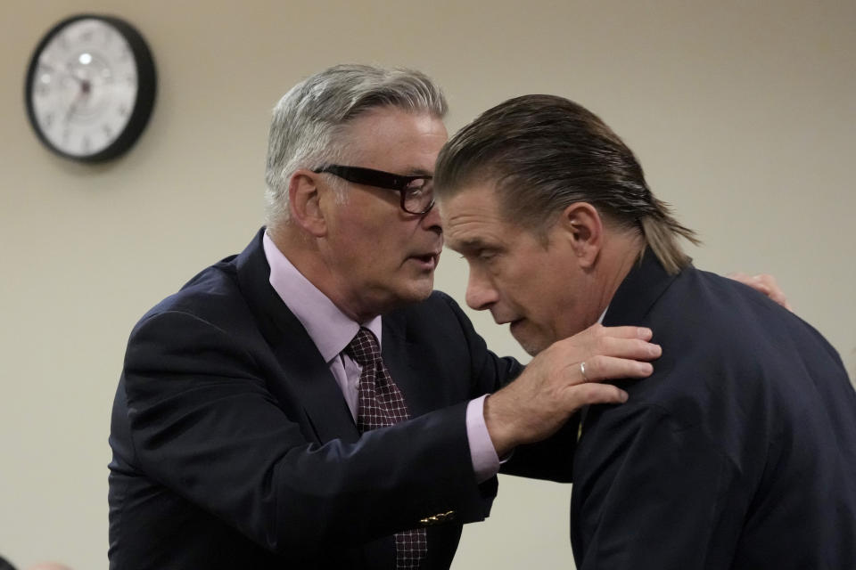 Actor Alec Baldwin, left, embraces his brother, actor Stephen Baldwin, during a break in his involuntary manslaughter trial over a fatal shooting on the set of the film, "Rust," in District Court, in Santa Fe, N.M., Wednesday, July 10, 2024. (AP Photo/Ross D. Franklin, Pool)