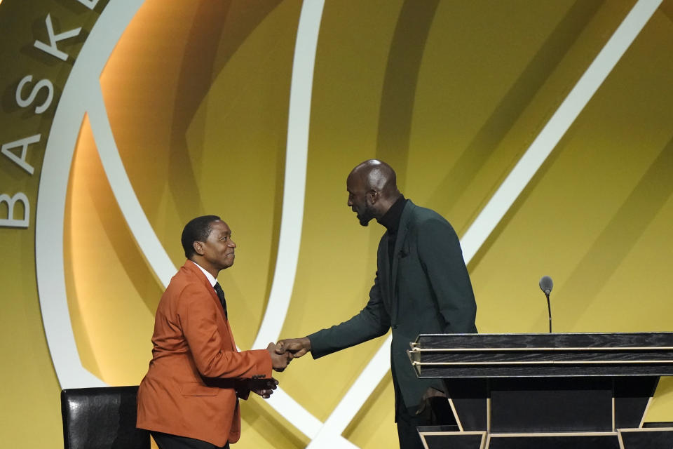 Kevin Garnett, right, thanks his presenter Isaiah Thomas, left, after speaking during his enshrinement into the 2020 class of the Basketball Hall of Fame, Saturday, May 15, 2021, in Uncasville, Conn. (AP Photo/Kathy Willens)
