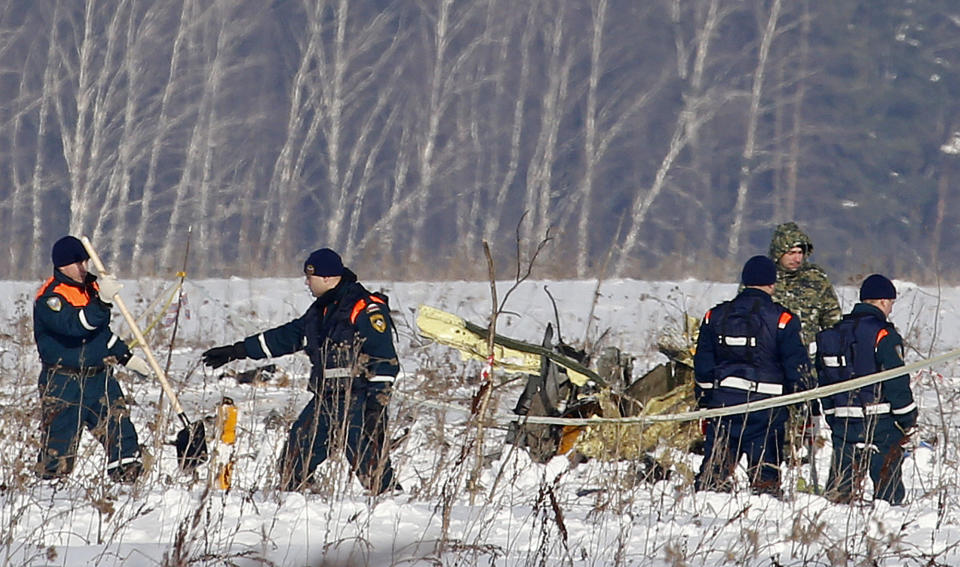 <p>Personnel work at the scene of a AN-148 plane crash in Stepanovskoye village, about 40 kilometers (25 miles) from the Domodedovo airport, Russia, Feb. 12, 2018. (Photo: Alexander Zemlianichenko/AP) </p>