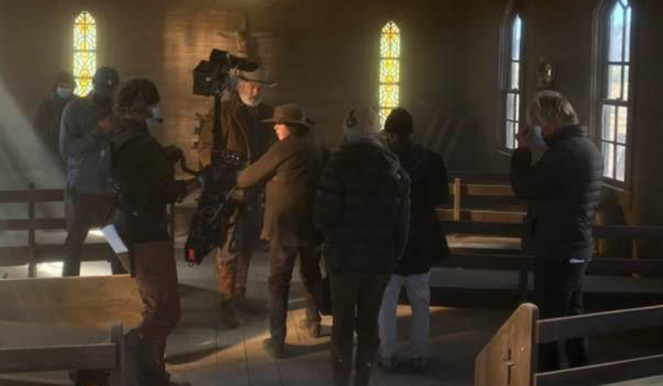 Alec Baldwin and Halyna Hutchins on the set of Rust in the last known photograph before she was killed (Serge Svetnoy)