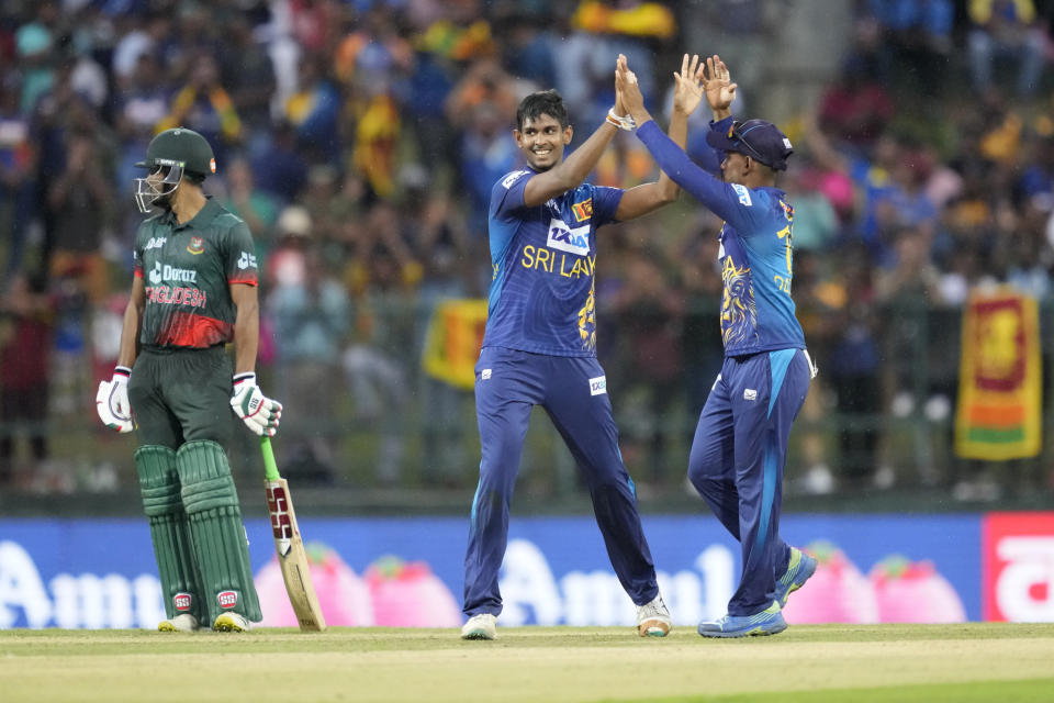 Sri Lanka's Matheesha Pathirana, centre, lcelebrates taking the wicket of Bangladeshes' Mushfiqur Rahim with teammate Pathum Nissanka during the one day international cricket match between Sri Lanka and Bangladesh of Asia Cup in Pallekele, Sri Lanka on Thursday, Aug. 31. (AP Photo/Eranga Jayawardena)