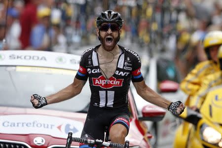 Giant-Alpecin rider Simon Geschke of Germany celebrates as he crosses the finish line to win the 161-km (100 miles) 17th stage of the 102nd Tour de France cycling race from Digne-les-Bains to Pra Loup in the French Alps mountains, France, July 22, 2015. REUTERS/Benoit Tessier