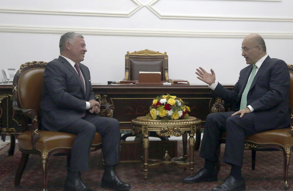 Iraqi President Barham Salih, right, meets with visiting Jordanian King Abdullah II, left, in the office of the Iraq Presidency at Salam Palace in Baghdad, Iraq, Monday, Jan. 14, 2019. (AP Photo/Khalid Mohammed)