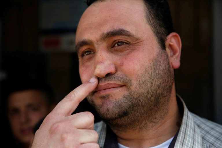 Palestinian Hitler Abu Hamad, deputy head at a West Bank school, points at his nose, which was allegedly broken when he was 15 by an Israeli army officer who asked him his name