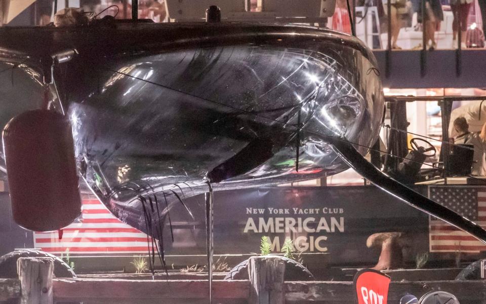 American Magic was left with a huge hole in the underside of the hull - AFP