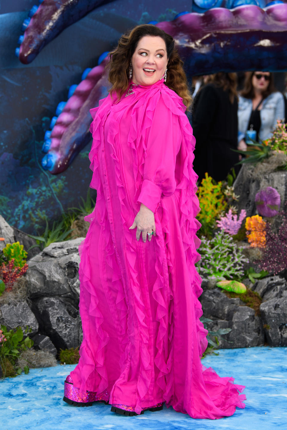 melissa McCarthy poses on a red carpet