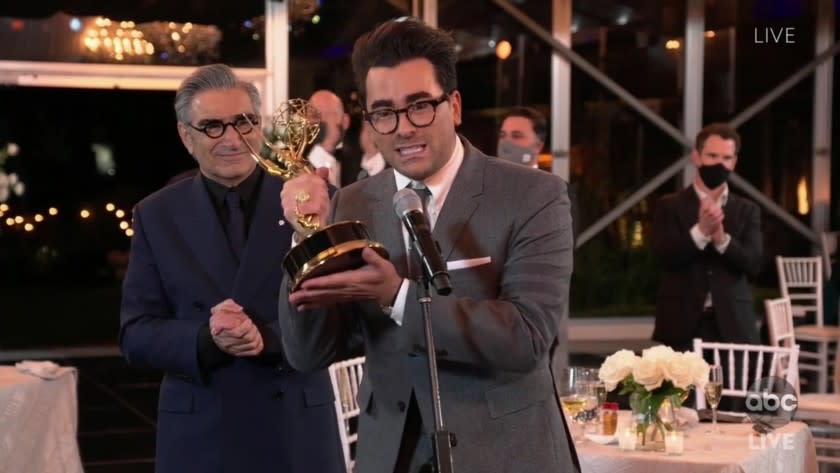 LOS ANGELES, CA: Dan and Eugene Levy after winning Outstanding Comedy Series for "Schitt's Creek" pictured in a screengrab from the telecast of the 72nd Annual Emmy Awards on ABC hosted by Jimmy Kimmel on September 20, 2020. CREDIT: ABC/ Walt Disney Television