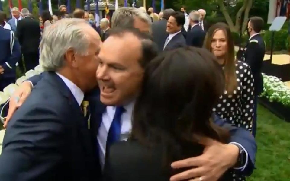 Senator Mike Lee, pictured hugging other attendees, has since tested positive - Matthew Fearn 