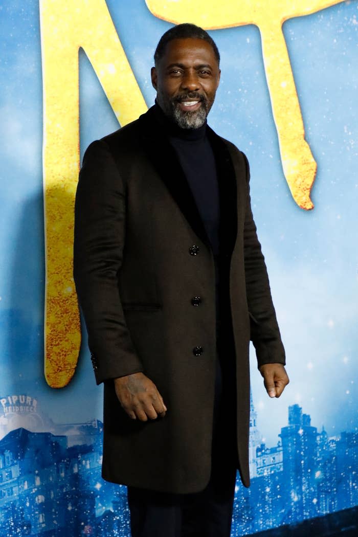 Idris smiling on the red carpet