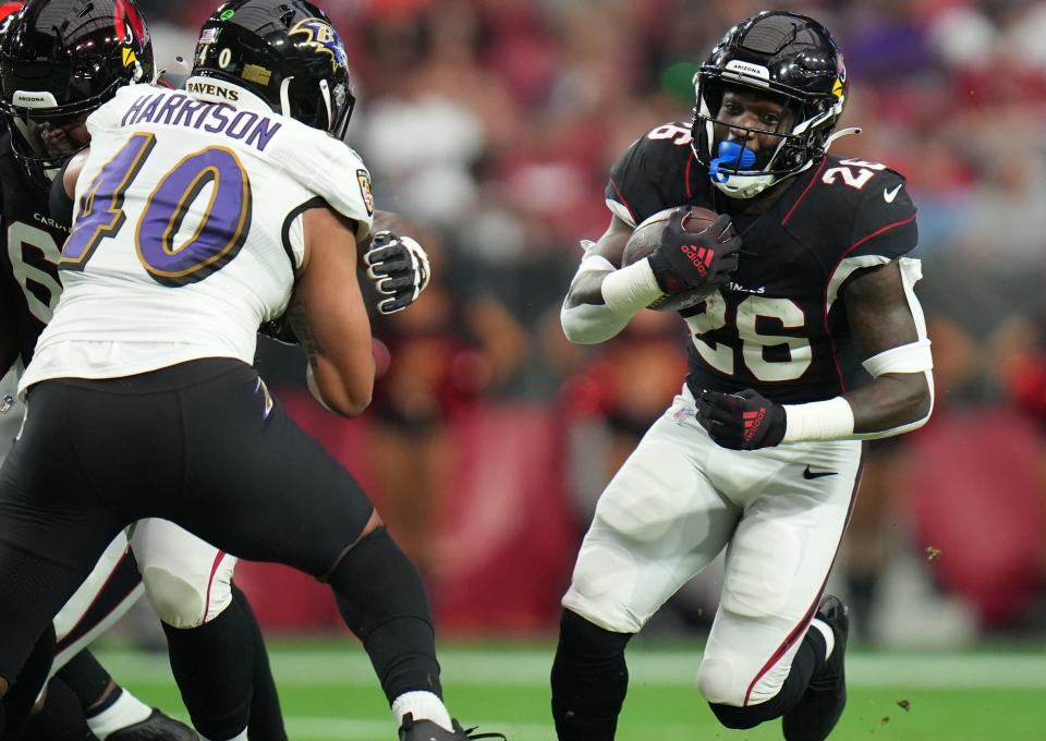 Aug 21, 2022; Glendale, AZ, United States; Arizona Cardinals running back Eno Benjamin breaks out of the backfield against the Baltimore Ravens at State Farm Stadium.