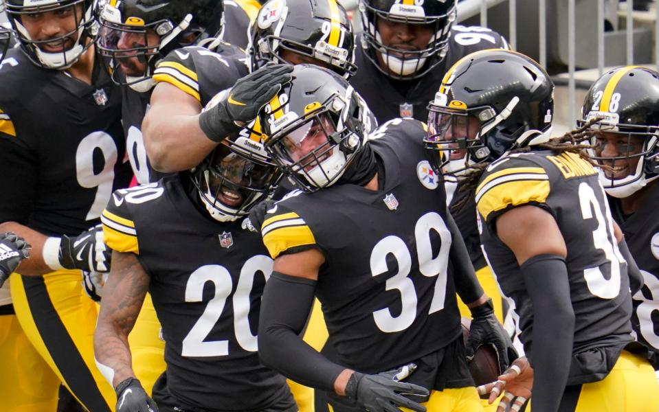 Pittsburgh Steelers free safety Minkah Fitzpatrick (39) is greeted by teammates in the end zone after intercepting a pass buy Cleveland Browns quarterback Baker Mayfield (6) and taking it in for a touchdown during the first half of an NFL football game, Sunday, Oct. 18, 2020, in Pittsburgh. - AP