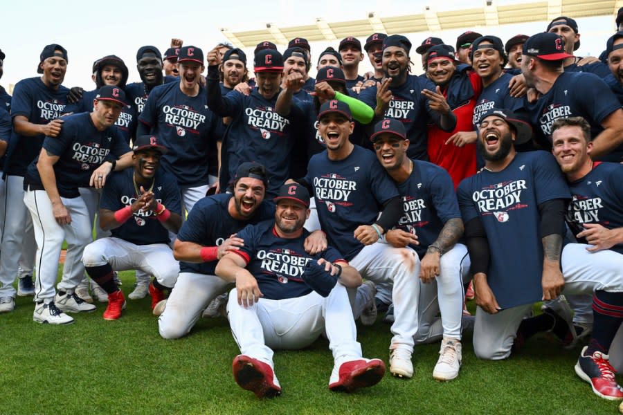 The Cleveland Guardians celebrate the team’s 3-2 10 inning win over the Minnesota Twins in a baseball game, Thursday, Sept. 19, 2024, in Cleveland. Cleveland clinched a playoff berth with the win. (AP Photo/Nick Cammett)