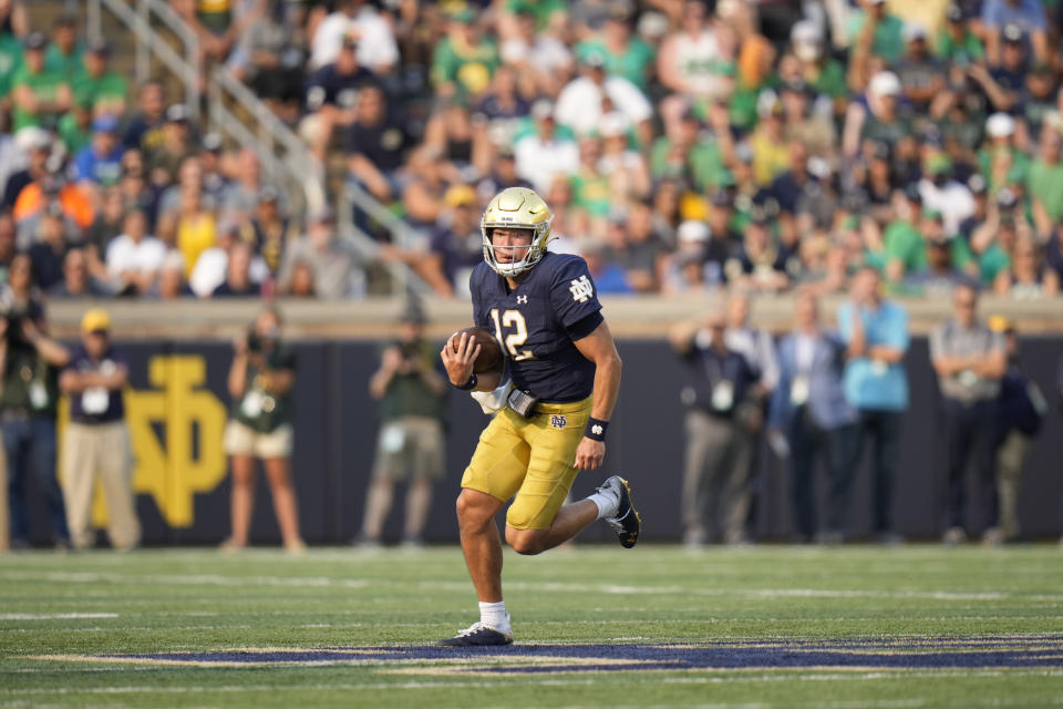 Notre Dame quarterback Tyler Buchner (12) in action against Toledo in an NCAA college football game in South Bend, Ind., Saturday, Sept. 11, 2021. Notre Dame won 32-29. (AP Photo/AJ Mast)