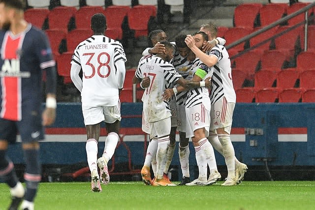 Marcus Rashford celebrates with his Manchester United team-mates after scoring the winner PSG on Tuesday