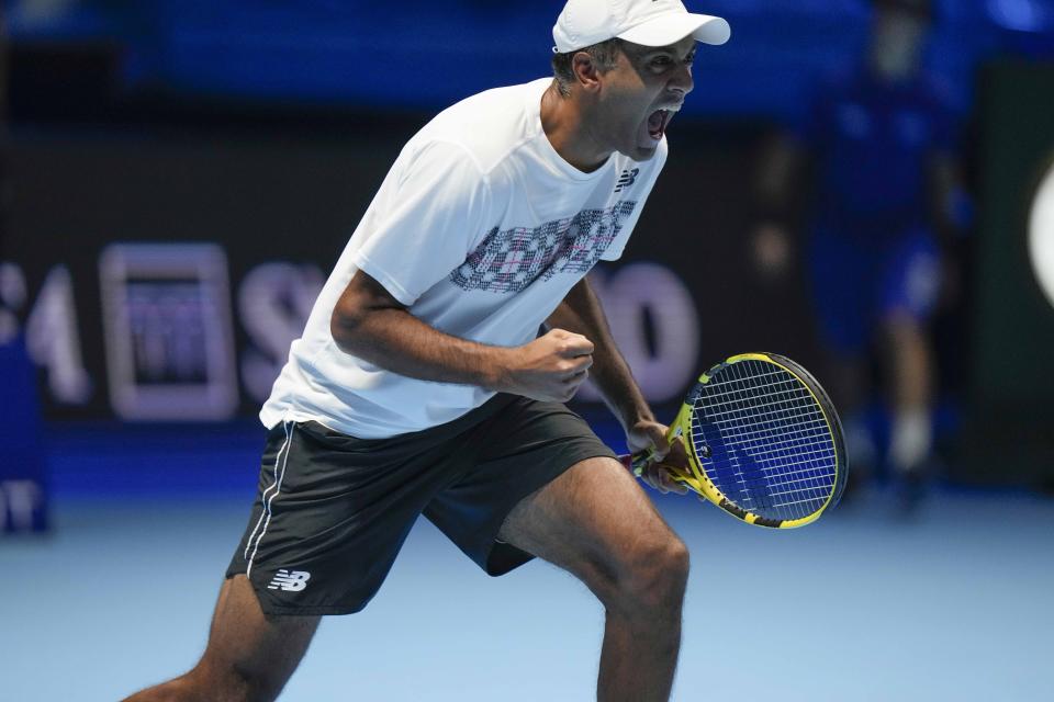 Rajeev Ram of the United States, and his teammate Britain's Joe Salisbury not in the frame celebrate after defeating Colombia's Robert Farah and Juan Sebastian Cabal during their ATP World Tour Finals double tennis match, at the Pala Alpitour in Turin, Friday, Nov. 19, 2021. (AP Photo/Luca Bruno)