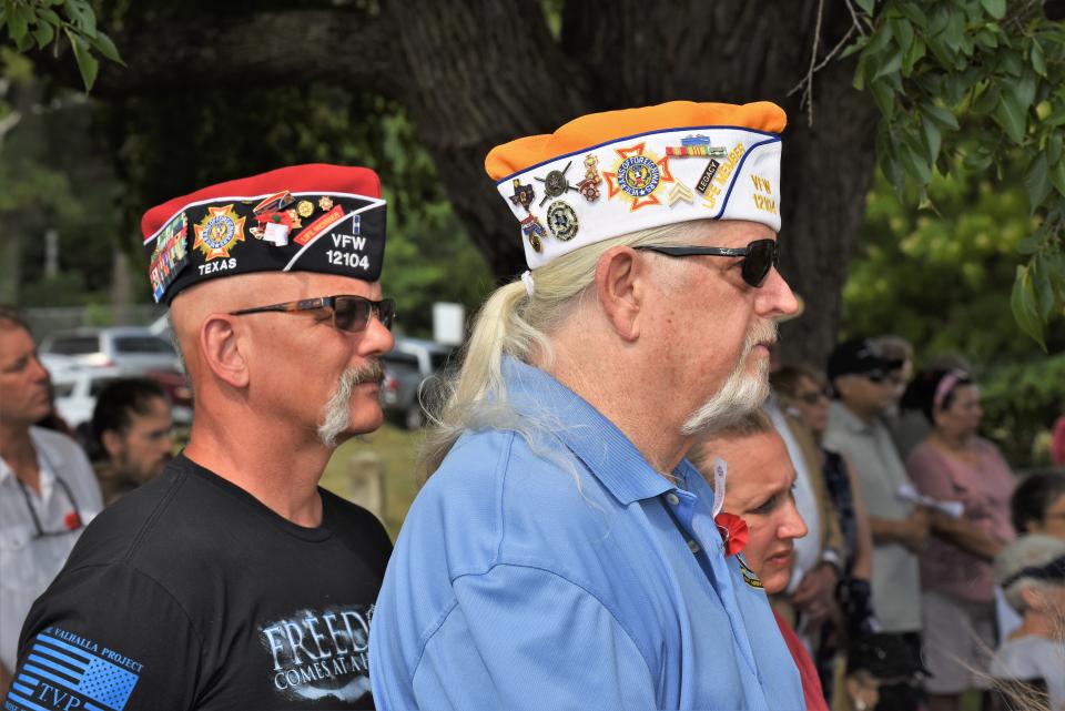 Veterans Matt Lutz (left) and Kevin Owens, members of Bastrop’s Ricky L. Dear VFW Post 12104, take part in Monday's Memorial Day ceremony at Fairview Cemetery.