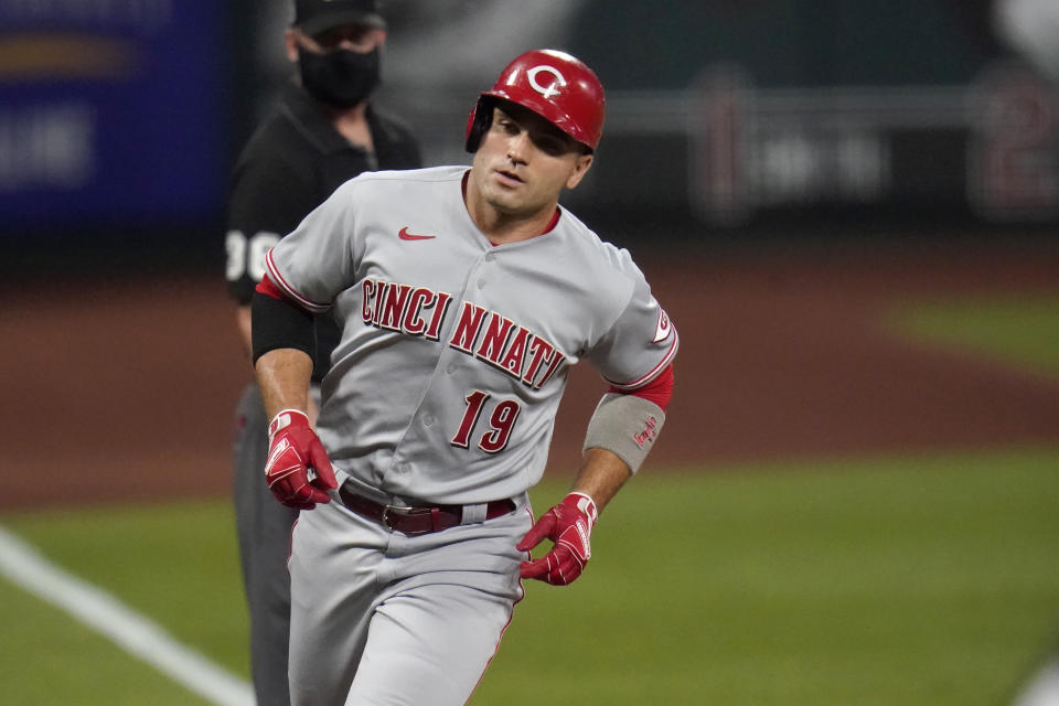 Cincinnati Reds' Joey Votto rounds the bases after hitting a two-run home run during the first inning of a baseball game against the St. Louis Cardinals Friday, Sept. 11, 2020, in St. Louis. (AP Photo/Jeff Roberson)