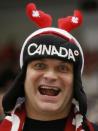 A Canadian supporter cheers before Canada plays the United States in their IIHF World Junior Championship ice hockey game in Malmo, Sweden, December 31, 2013. REUTERS/Alexander Demianchuk (SWEDEN - Tags: SPORT ICE HOCKEY)