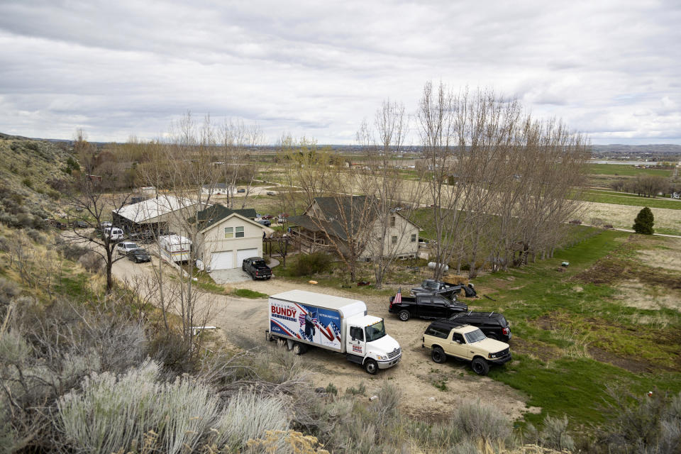 FILE - Supporters gather on the property of former Idaho gubernatorial candidate and far-right activist Ammon Bundy after law enforcement officers attempted to arrest Bundy on a misdemeanor warrant for contempt of court earlier in the day, on Monday, April 24, 2023, in Emmett, Idaho. Bundy was not home at the time, and the officers left. The contempt warrant came in a defamation lawsuit brought against Bundy and others by a regional hospital system. (AP Photo/Kyle Green, File)