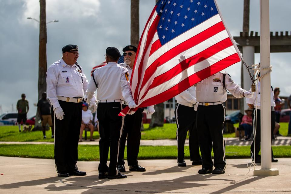 An honor guard prepares to raise an American flag at a Memorial Day ceremony on Monday, May 30, 2022 at Sherrill Park.