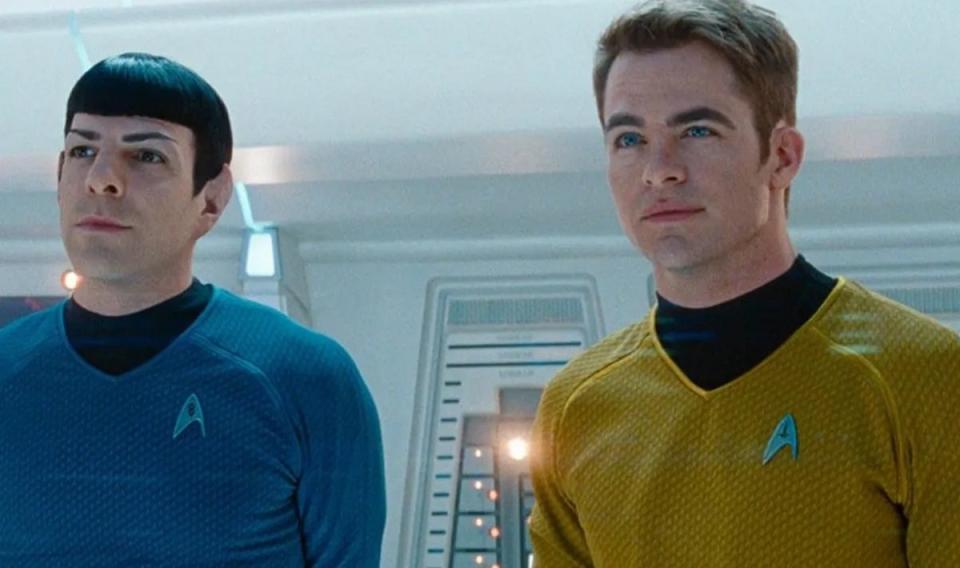 Spock (Zachary Quinto) and Kirk (Chris Pine) wearing their Kelvin timeline Starfleet uniforms.