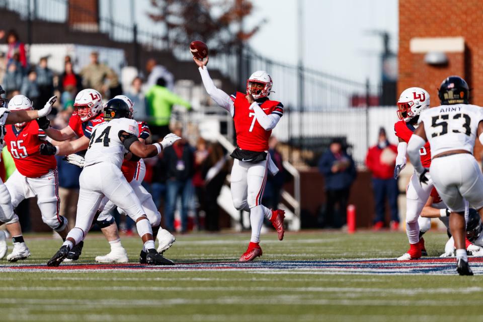 Liberty quarterback Malik Willis gets time to throw the ball against Army. ELLIE RICHARDSON/For Liberty Athletics